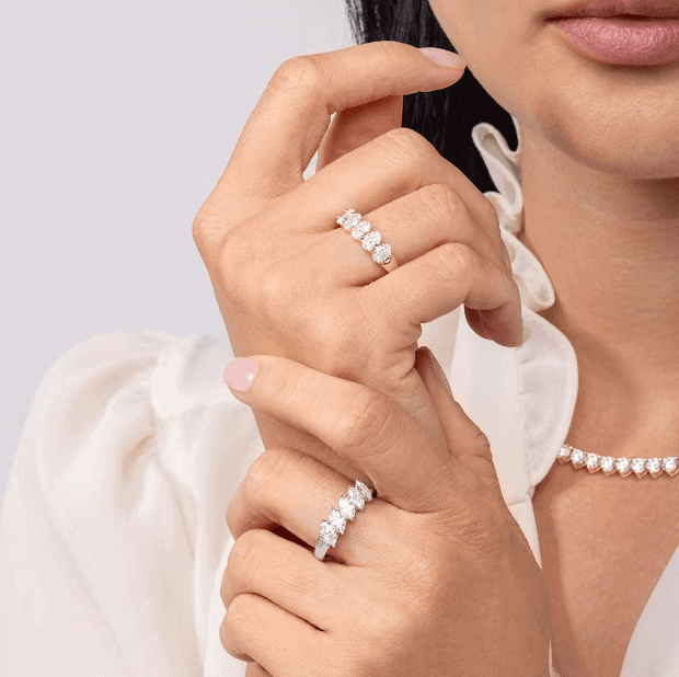 five stone oval diamond bands on the woman's fingers
