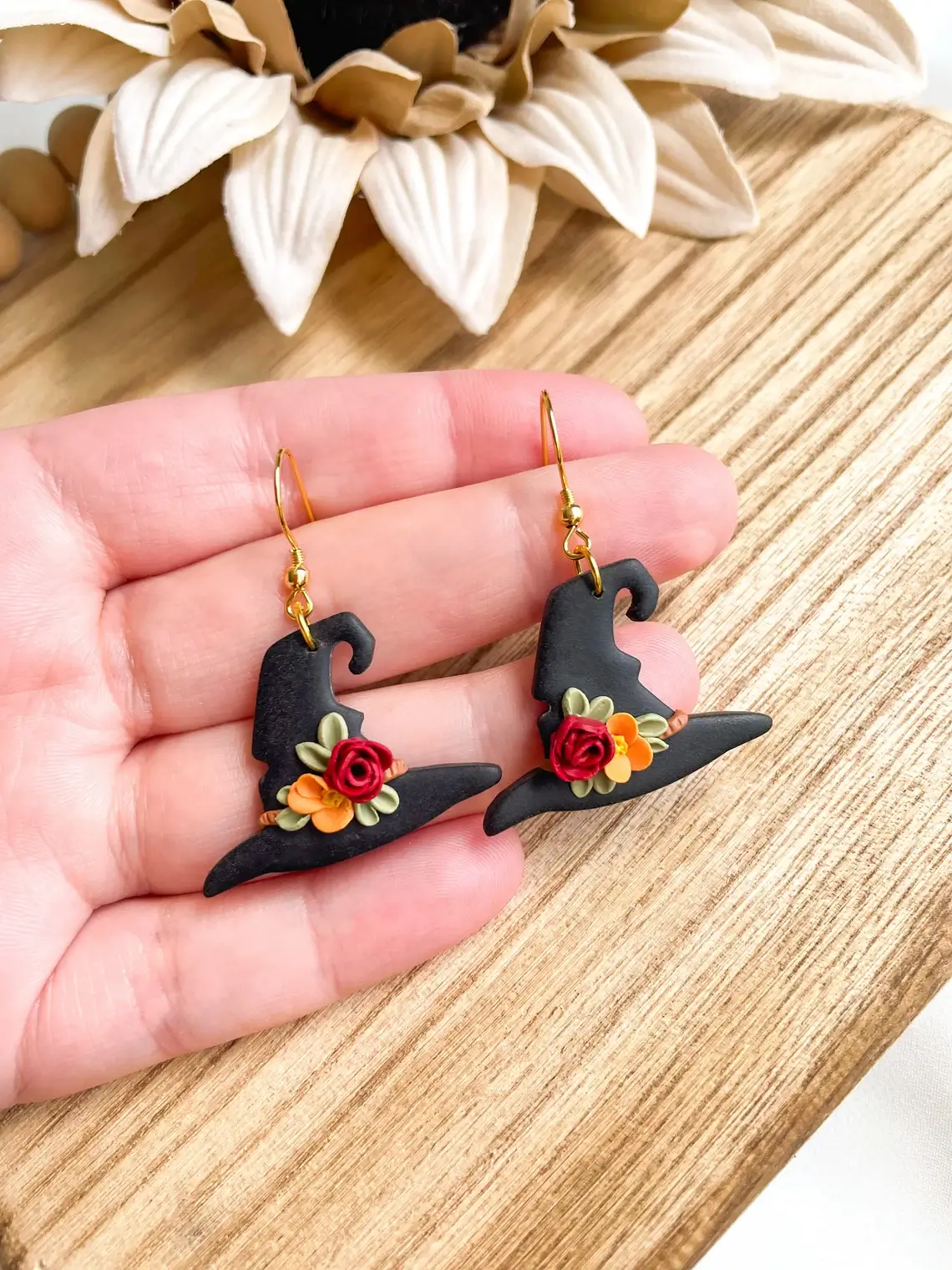 floral black witch hat earrings