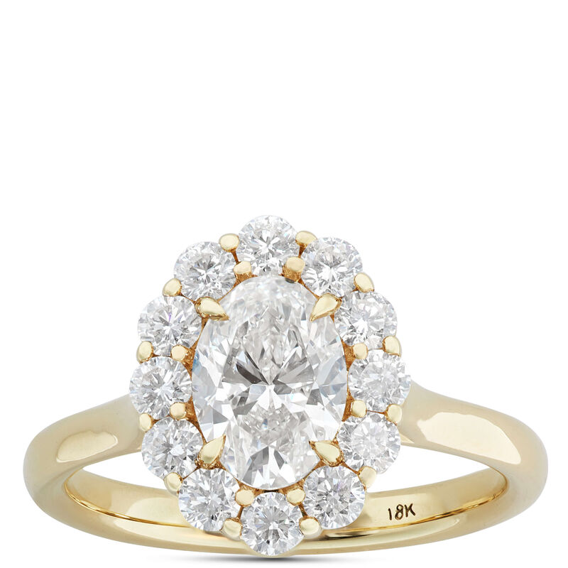 oval shaped diamond engagement ring in yellow gold setting