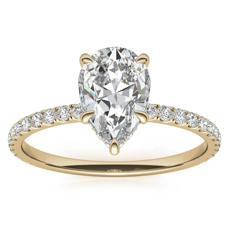 pear moissanite engagement ring in yellow gold setting