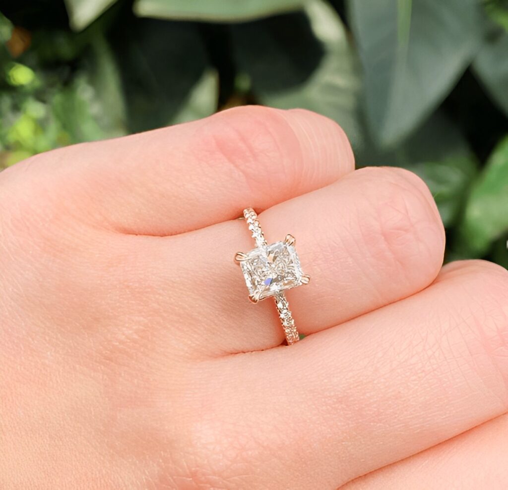 radiant cut diamond engagement ring on the ring finger