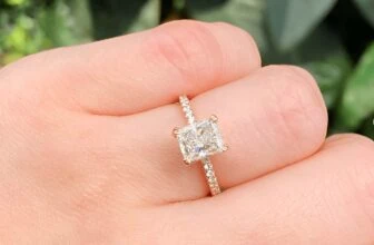 radiant cut diamond engagement ring on the ring finger