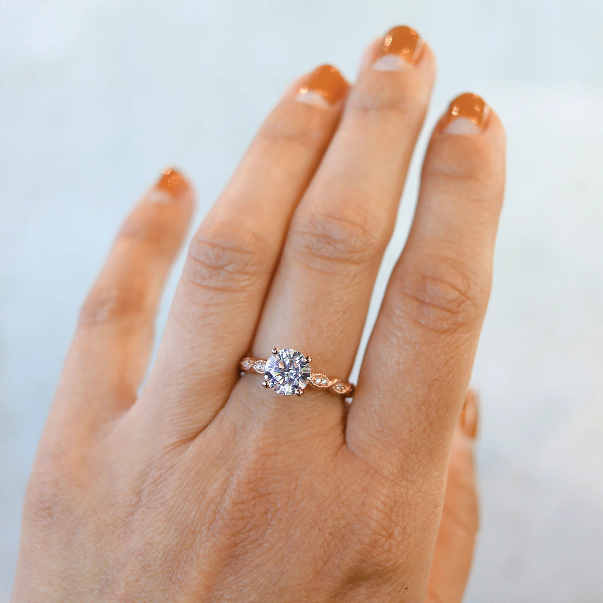 round cut four prong diamond engagement ring