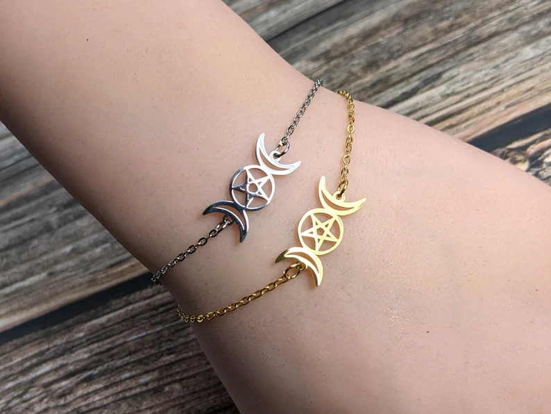triple moon bracelet in silver and gold setting
