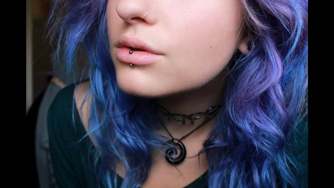 a woman with vertical labret piercing