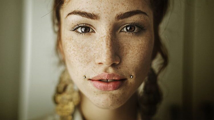 a woman with dahlia lip piercing