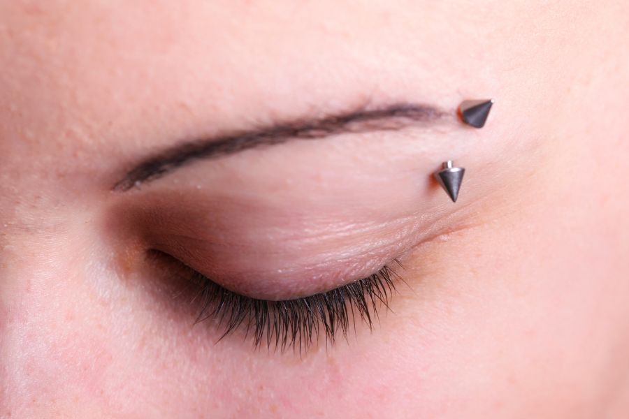 close up view of eyebrow piercing