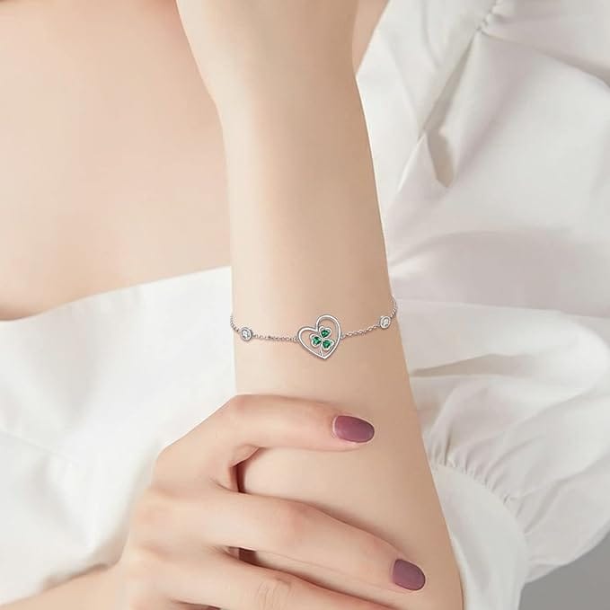 silver shamrock bracelet on the woman's wrist