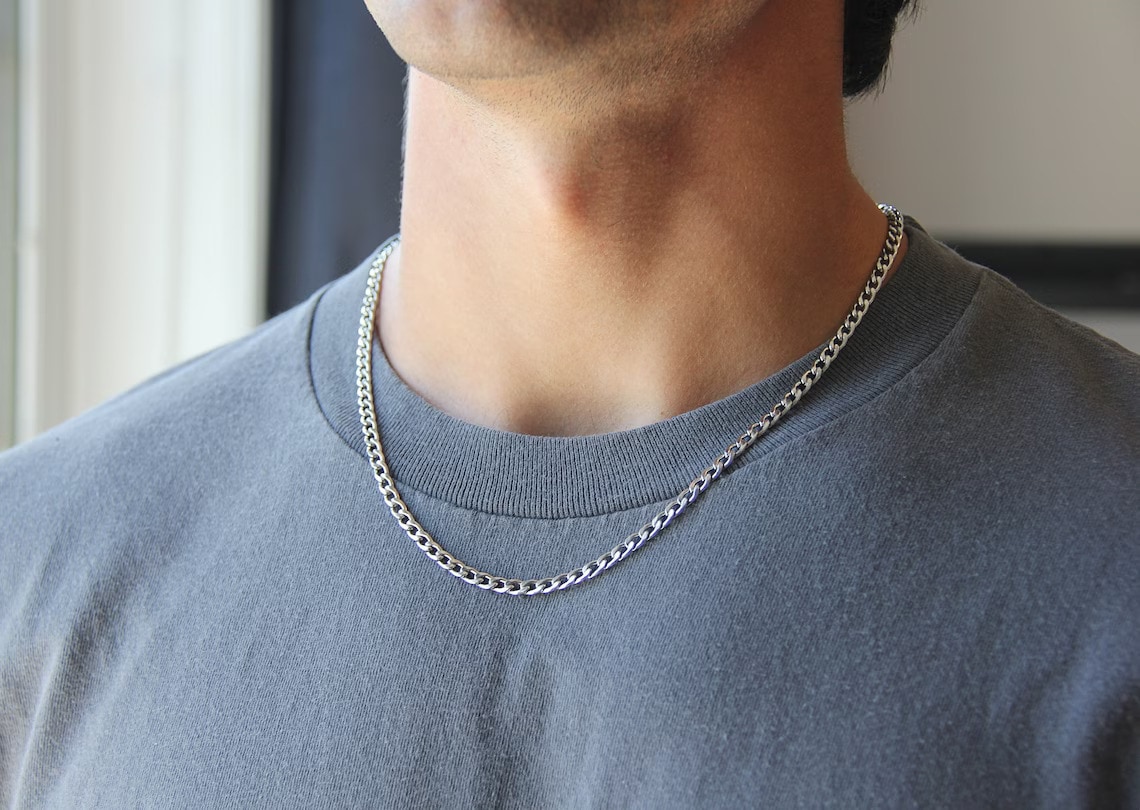curb chain necklace on the man's neck