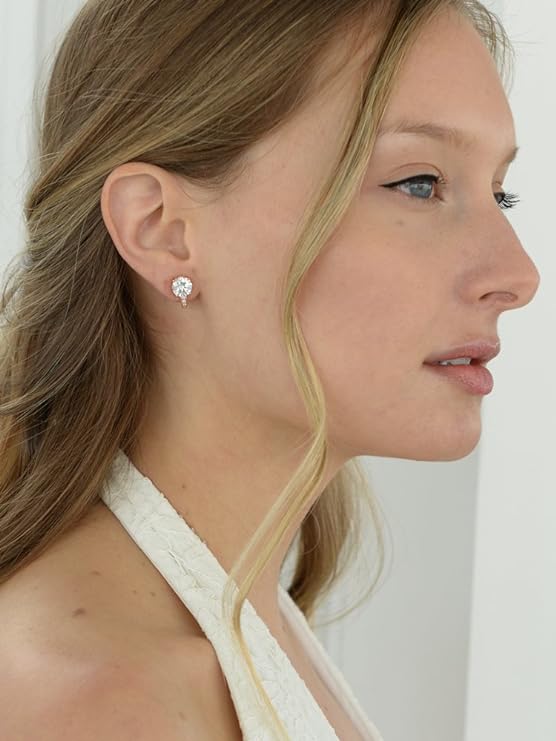 a woman wearing a cz gold stud clip-on earring