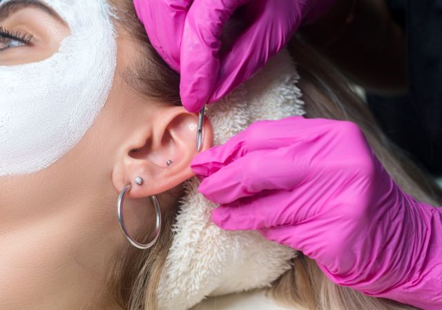 helix piercing on the woman's ear
