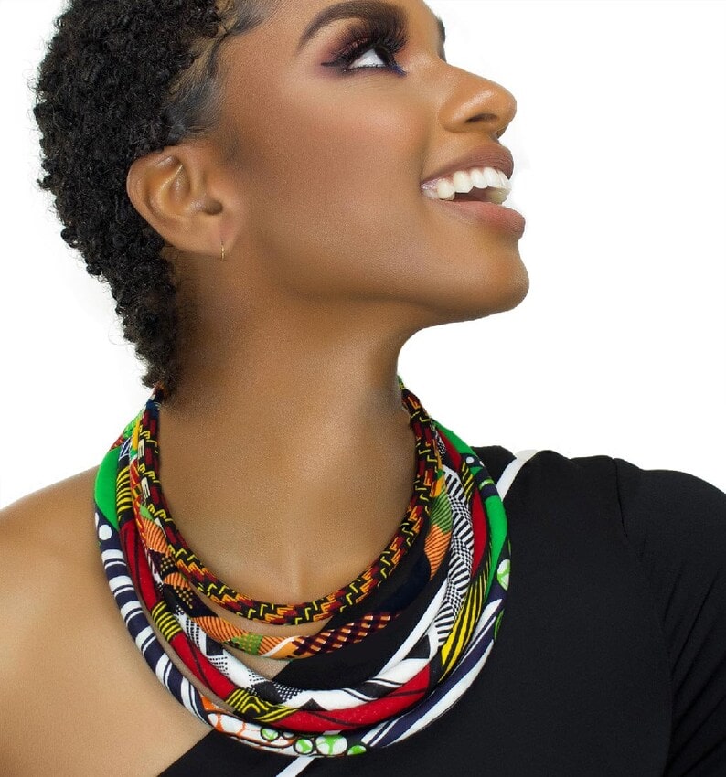 a woman wearing african print bid necklace
