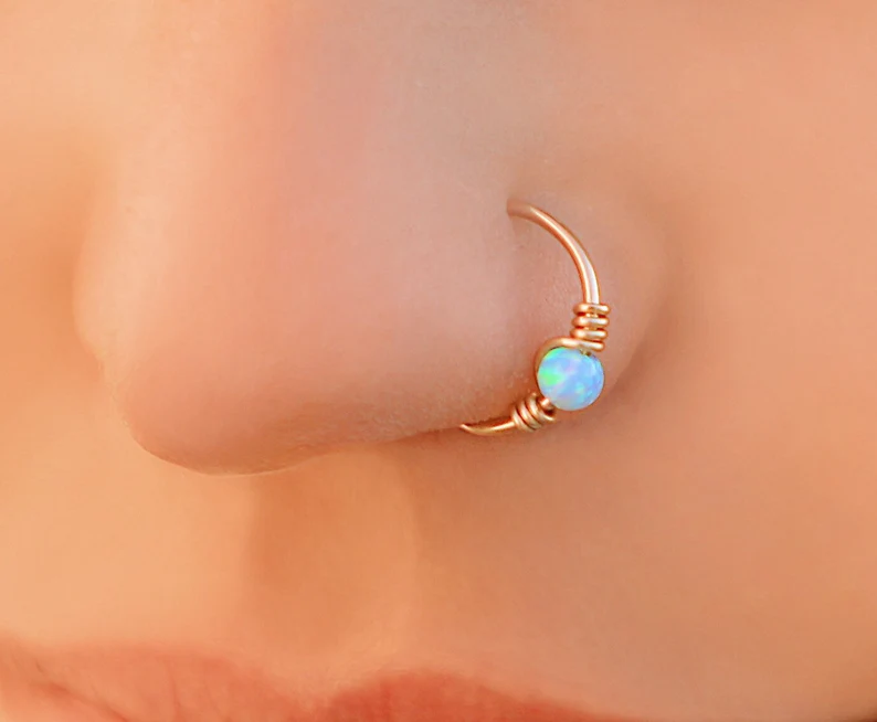 Gold fire opal piercing