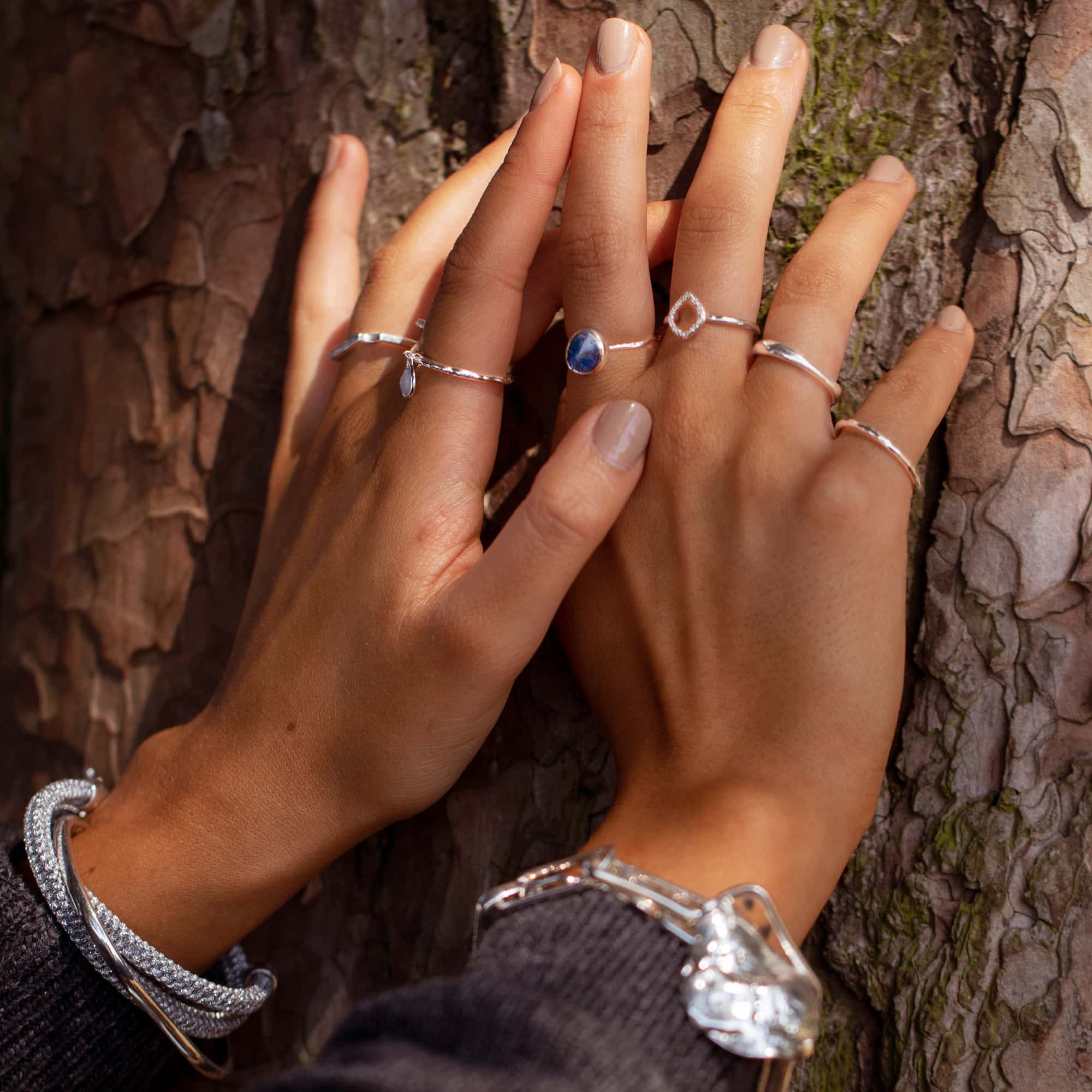 white gold rings on the fingers