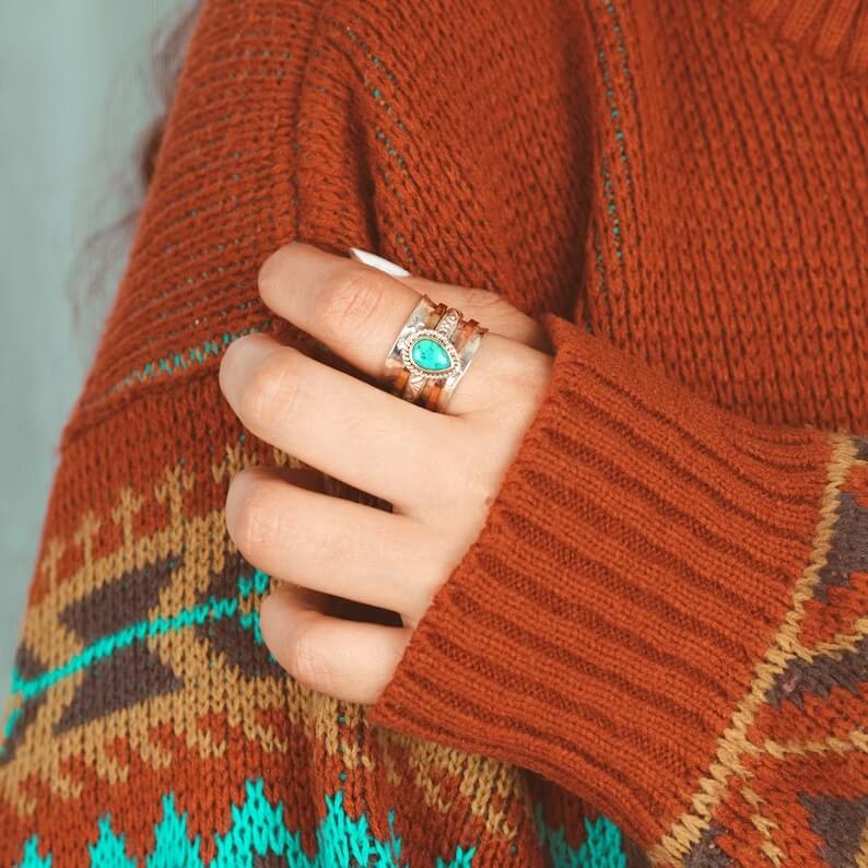 turquoise bohemian style ring on the finger