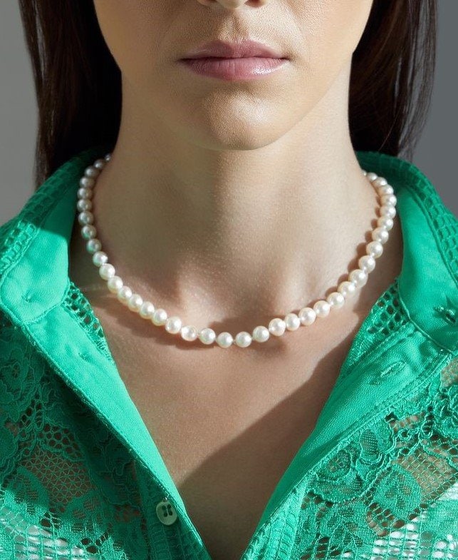 white akoya pearl necklace on the woman's neck