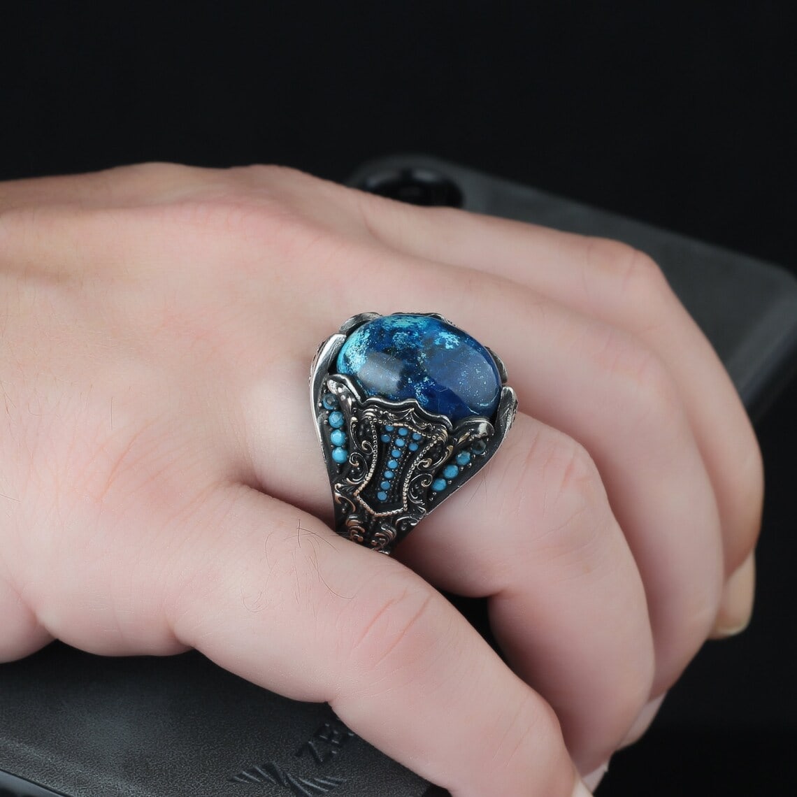 azurite gemstone ring on the finger